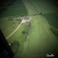 an aerial view of a farm and a house